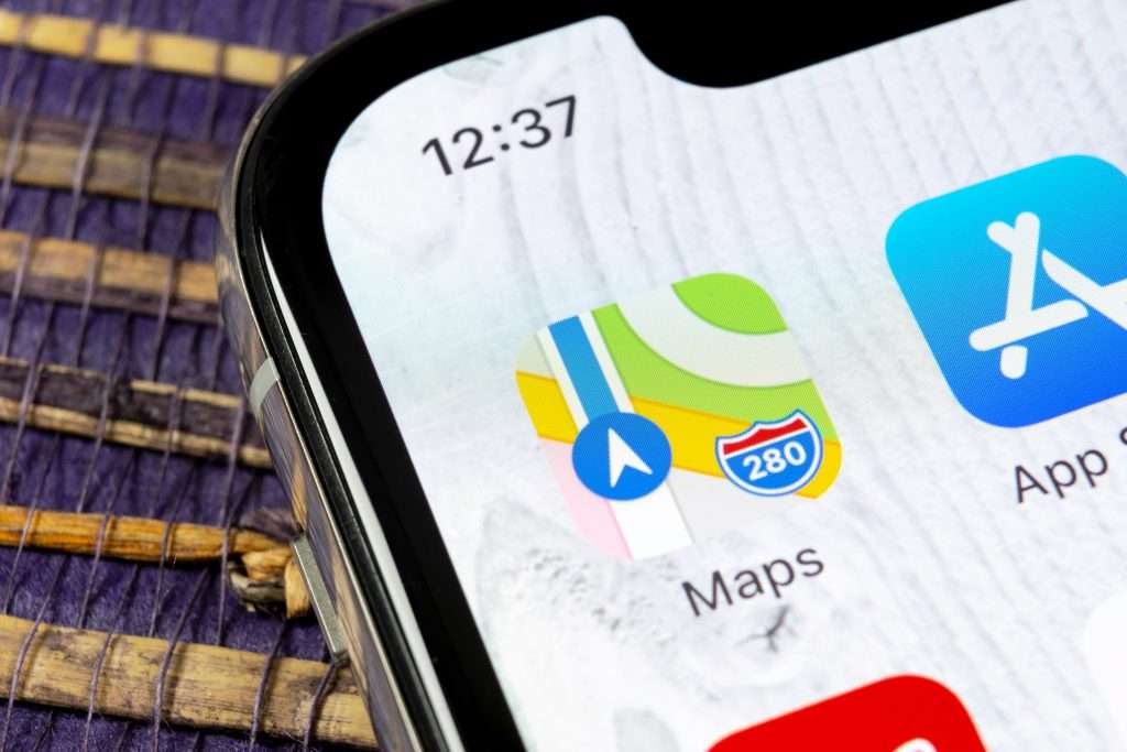 Apple Maps icon on a black iPhone screen