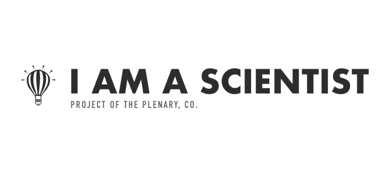 Black and white logo with a hot air balloon icon and the text I AM A SCIENTIST in bold, with PROJECT OF THE PLENARY, CO. in smaller letters underneath.